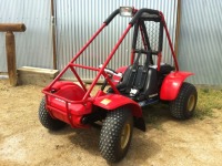 Red Honda Odyssey FL250 with Roll Bar